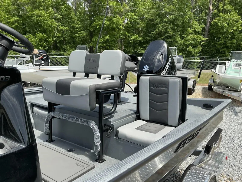 Slide: The Image of 2025 Excel Bay Pro 203 ELITE boat with Suzuki engine, featuring comfortable seating. - 7