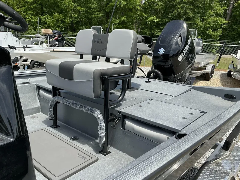 Slide: The Image of 2025 Excel Bay Pro 203 ELITE boat with Suzuki engine, featuring dual seating and spacious deck. - 9