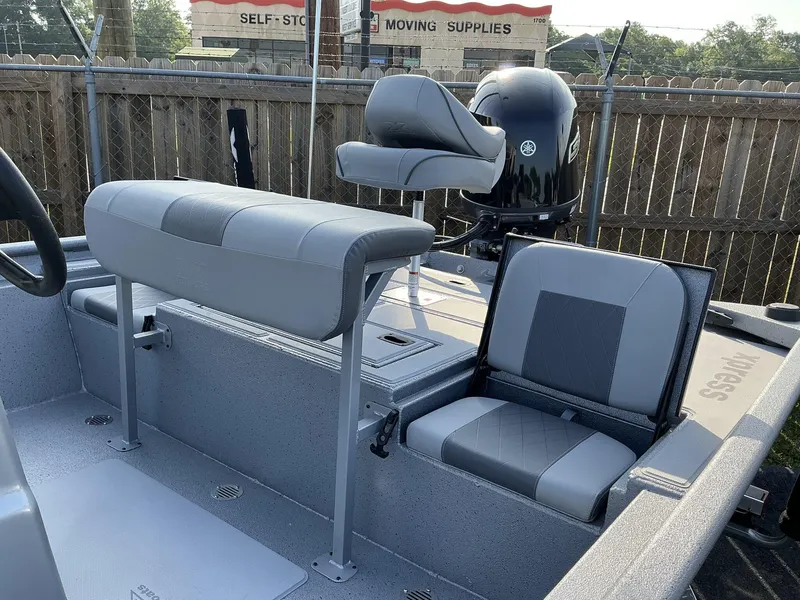 Slide: The Image of 2025 Xpress Xplorer Series XP20CC boat interior with gray seating and Yamaha motor. - 5