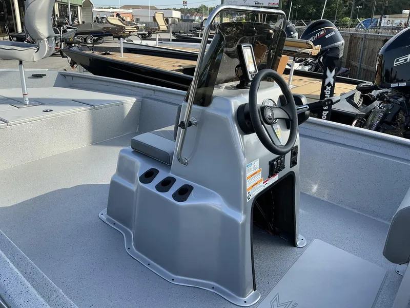 Slide: The Image of 2025 Xpress Xplorer Series XP20CC boat console with steering wheel and seating. - 6