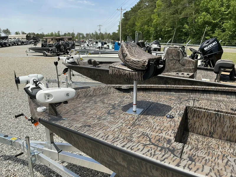 Slide: The Image of 2025 Xpress Hyper-Lift Series H22B boat with camouflage design in a dealership lot. - 5