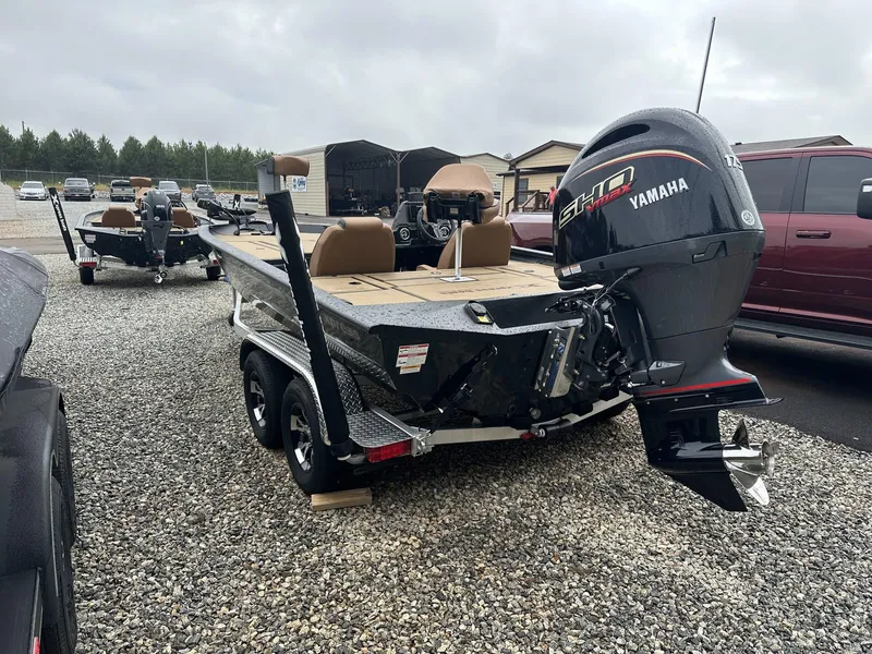 Slide: The Image of 2025 Xpress Hyper-Lift Bass Series boat with Yamaha engine on gravel lot. - 3