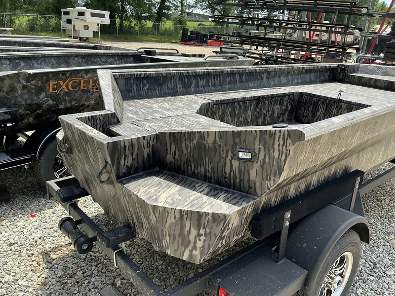 Slide: The Image of 2025 Reaper Boats 656 model with camouflage design on a trailer. - 4