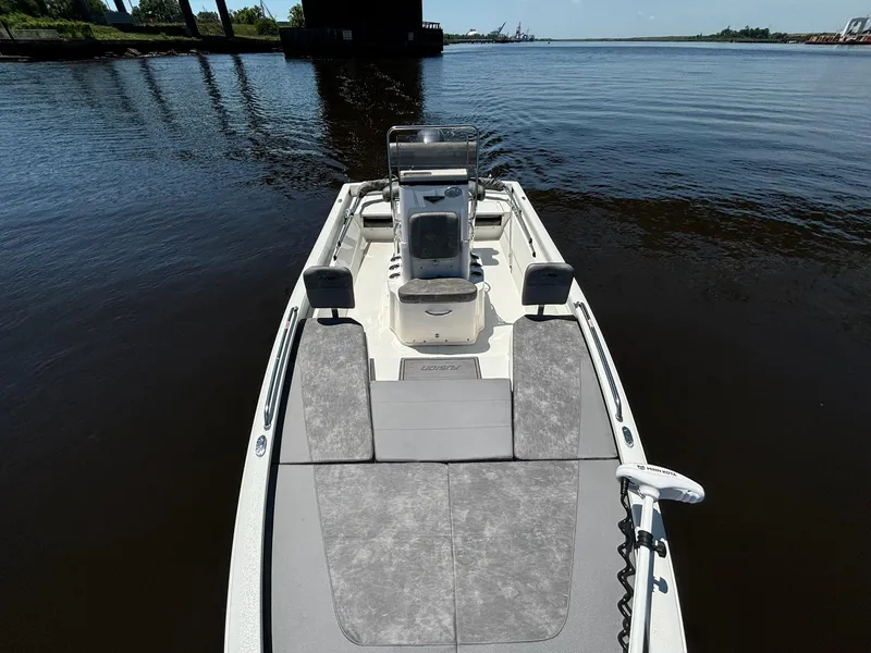 Slide: The Image of 2023 Avid 21 Fusion boat on calm water, featuring sleek design and modern seating. - 3