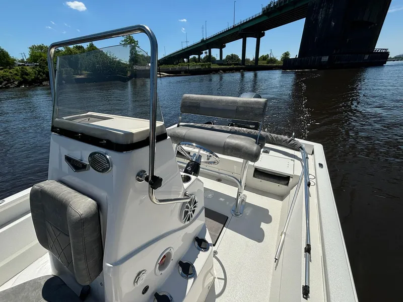Slide: The Image of Avid 21 Fusion 2023 boat on a river near a bridge, sunny day. - 7