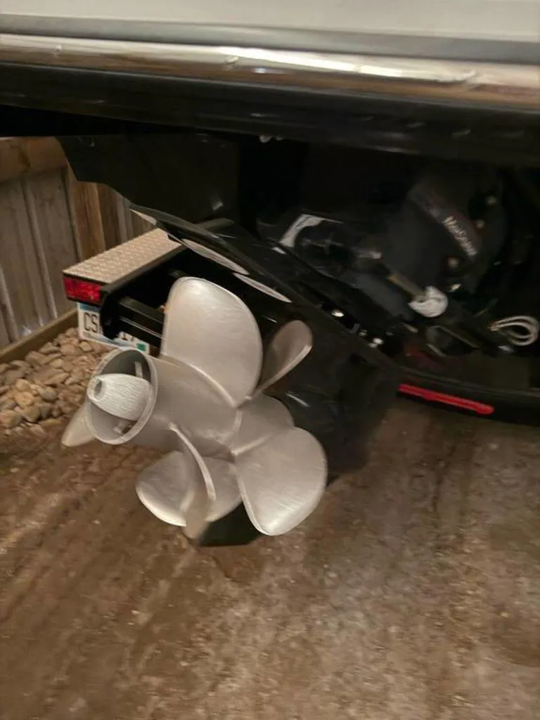 Slide: The Image of 2023 Monterey 258SS boat propeller in a garage setting. - 14