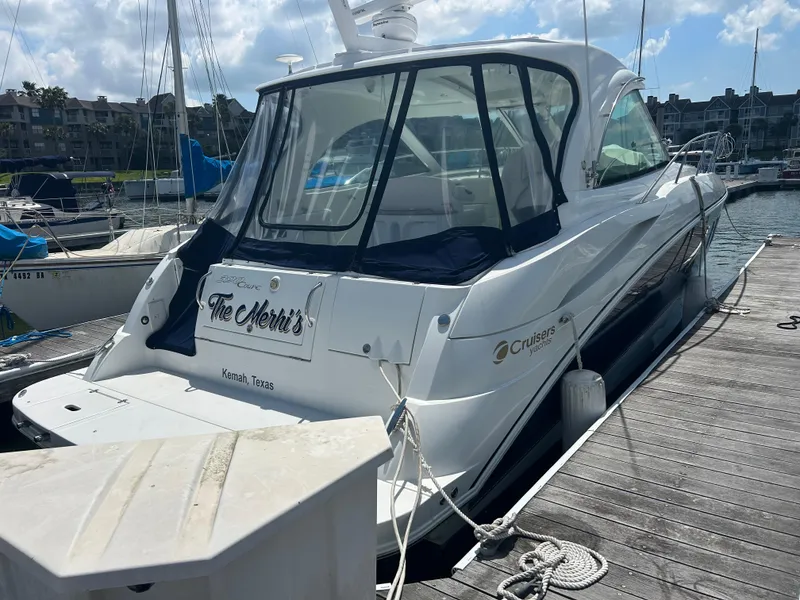 Slide: The Image of 2009 Cruisers Yachts 390 Sports Coupe docked at marina under sunny skies. - 14