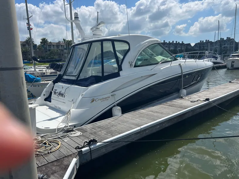 Slide: The Image of 2009 Cruisers Yachts 390 Sports Coupe docked at marina under blue sky. - 15