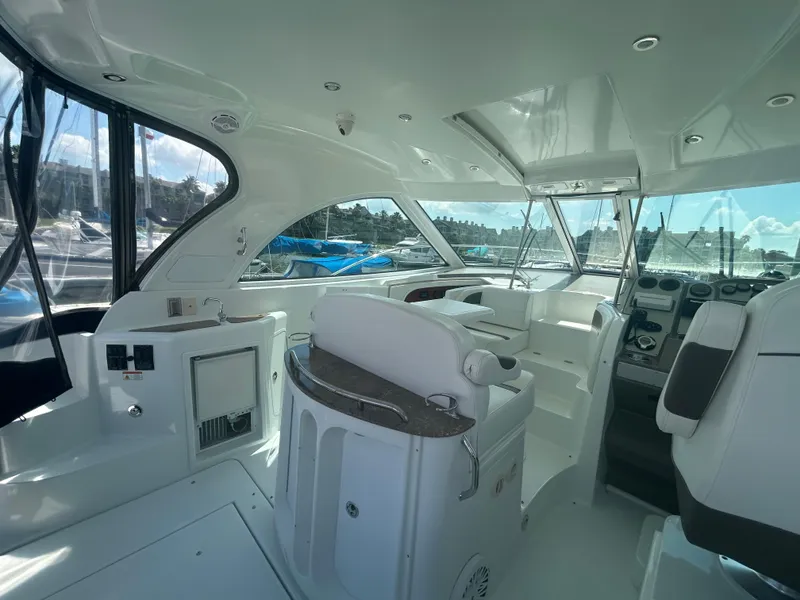 Slide: The Image of 2009 Cruisers Yachts 390 Sports Coupe interior with helm and seating area. - 19