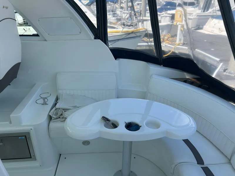 Slide: The Image of 2009 Cruisers Yachts 390 Sports Coupe interior with white seating and table. - 22
