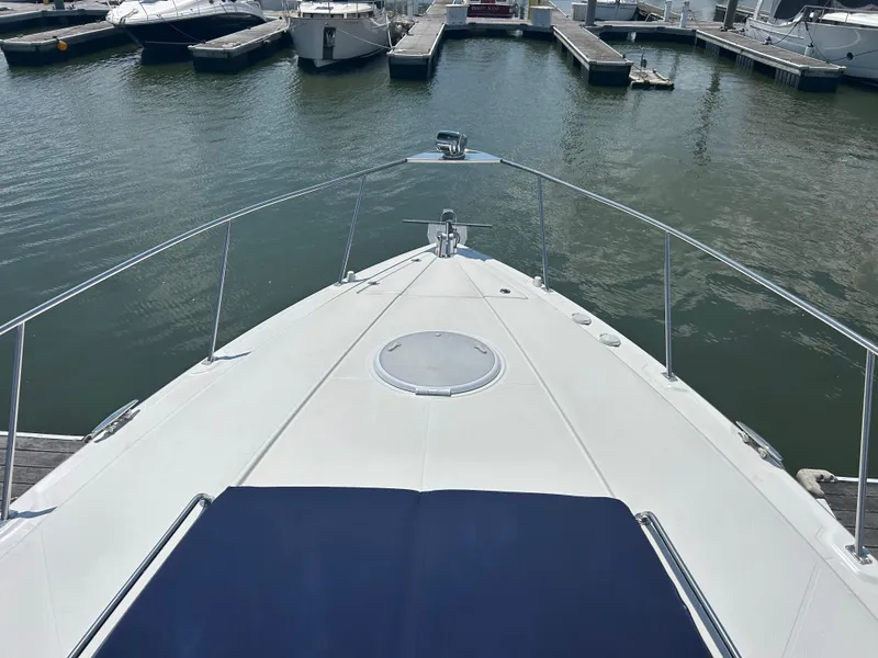 Slide: The Image of 2009 Cruisers Yachts 390 Sports Coupe docked at marina, view from bow. - 35