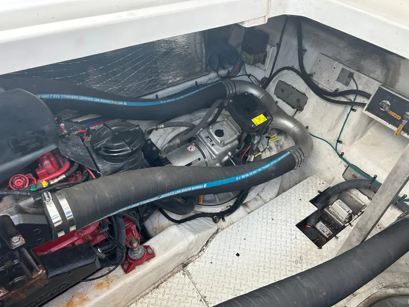 Slide: The Image of Engine compartment of 2009 Cruisers Yachts 390 Sports Coupe with visible hoses and components. - 43