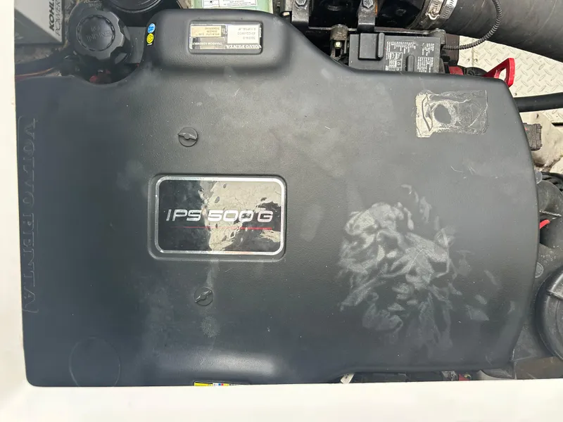 Slide: The Image of Engine cover of a 2009 Cruisers Yachts 390 Sports Coupe, featuring IPS500G branding. - 45