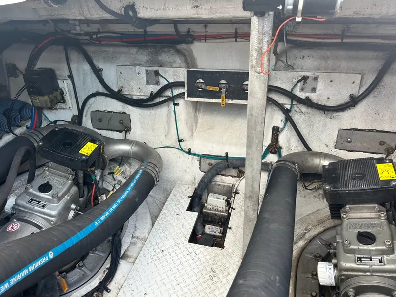 Slide: The Image of Engine room of 2009 Cruisers Yachts 390 Sports Coupe with visible machinery and wiring. - 46