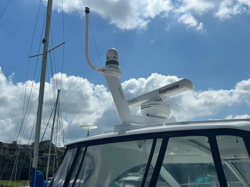 Slide: The Image of 2009 Cruisers Yachts 390 Sports Coupe with Raymarine radar under a cloudy sky. - 18