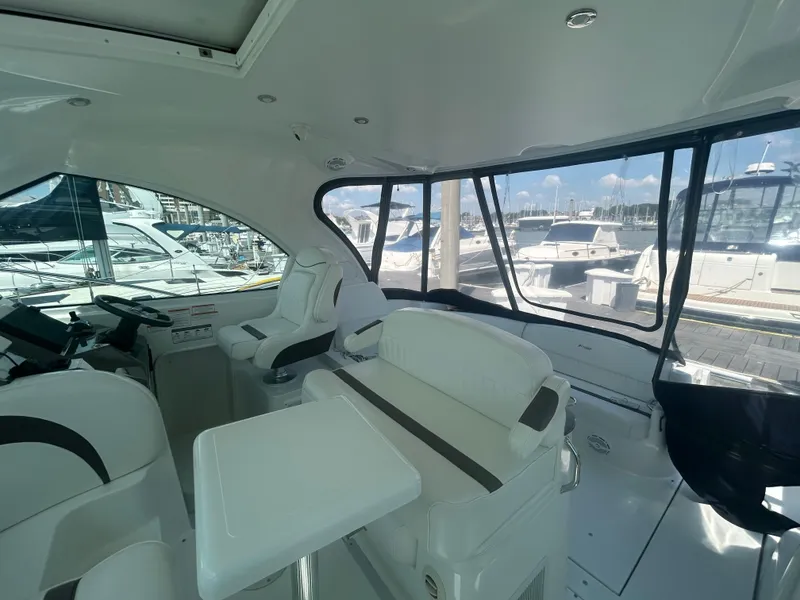 Slide: The Image of Interior of 2009 Cruisers Yachts 390 Sports Coupe, featuring sleek seating and modern design. - 20