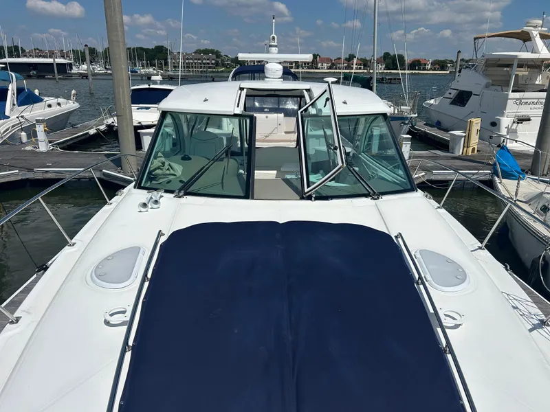 Slide: The Image of 2009 Cruisers Yachts 390 Sports Coupe docked at marina under clear sky. - 34