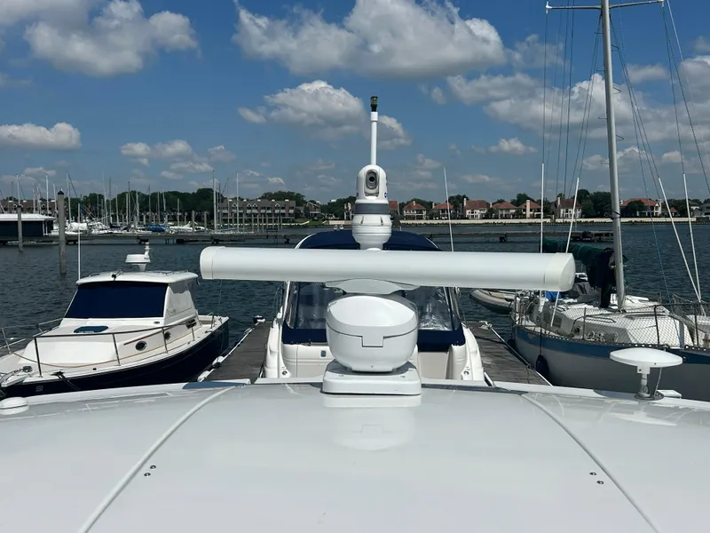Slide: The Image of 2009 Cruisers Yachts 390 Sports Coupe docked at marina under blue sky. - 37