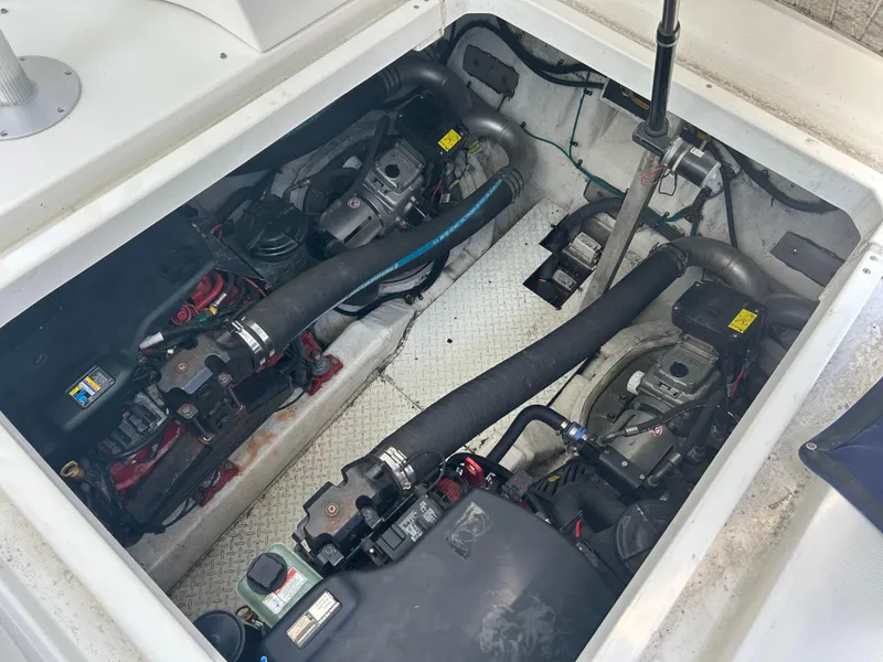 Slide: The Image of Engine compartment of 2009 Cruisers Yachts 390 Sports Coupe, showcasing dual engines. - 40