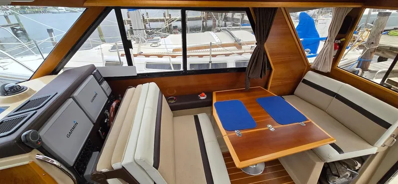 Slide: The Image of Interior of 2013 Cutwater C-28 boat with seating and dining area. - 18