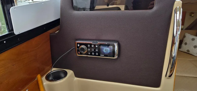 Slide: The Image of Interior of 2013 Cutwater C-28 boat featuring a mounted stereo system. - 27