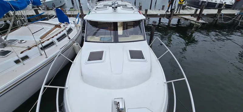 Slide: The Image of 2013 Cutwater C-28 boat docked at marina, top view. - 7