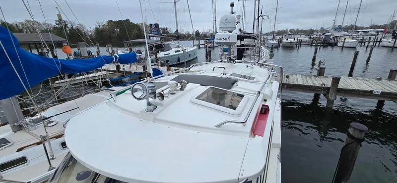 Slide: The Image of 2013 Cutwater C-28 boat docked at a marina, surrounded by other vessels. - 9