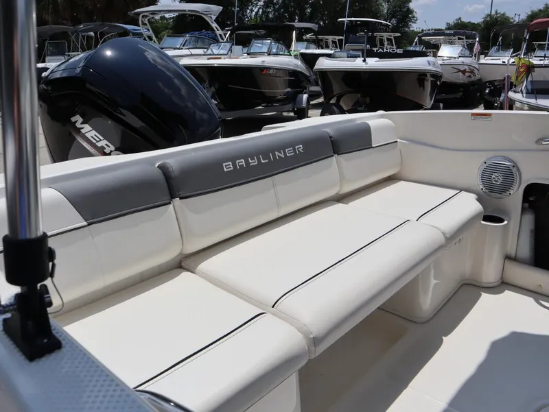 Slide: The Image of 2022 Bayliner 170 BR boat interior with cushioned seating and sleek design. - 10