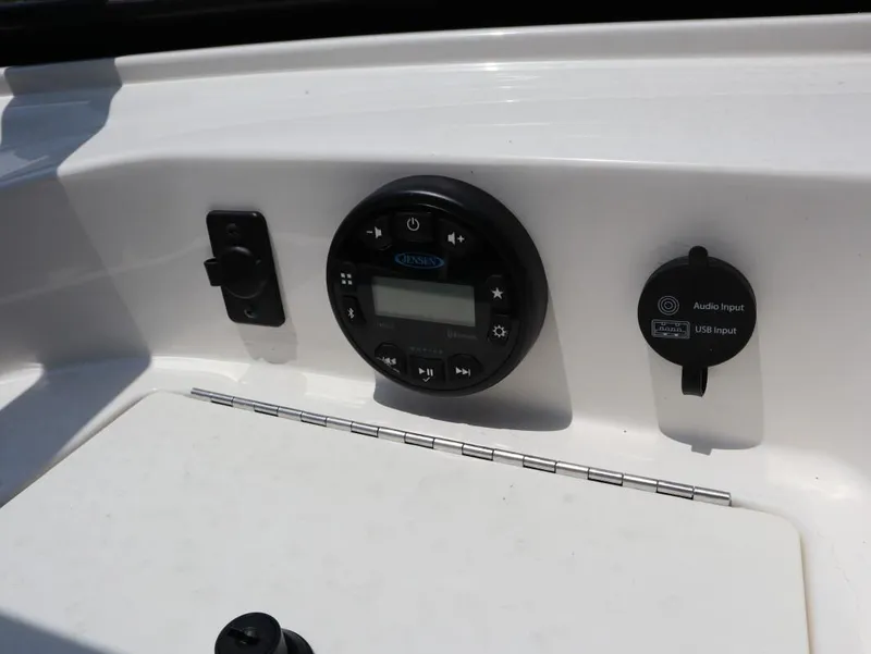 Slide: The Image of Control panel of 2022 Bayliner 170 BR boat with audio and USB inputs. - 16