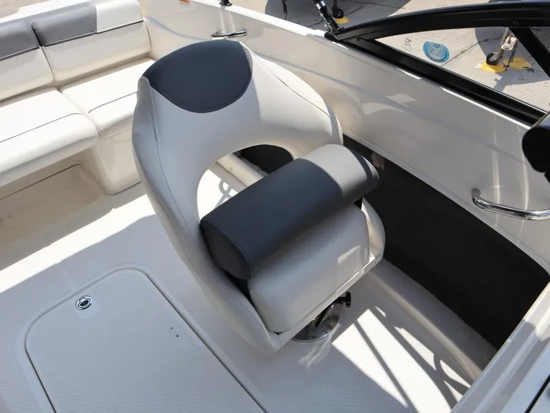 Slide: The Image of 2022 Bayliner 170 BR boat interior with white and gray seating. - 19