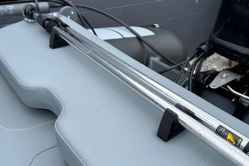 Slide: The Image of 2024 Highfield Classic 340 FCT boat detail showing steering mechanism and controls. - 11