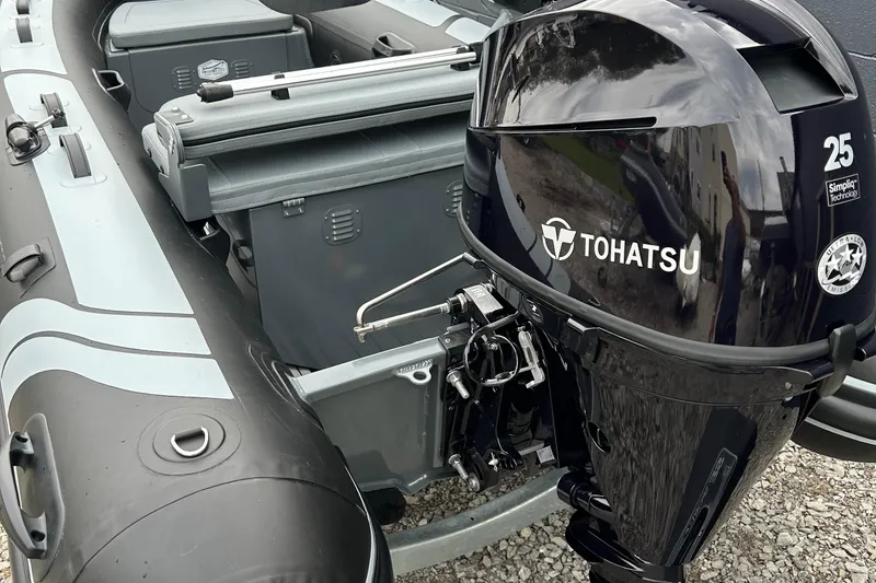 Slide: The Image of 2024 Highfield Classic 340 FCT boat with Tohatsu 25 outboard motor, side view. - 13