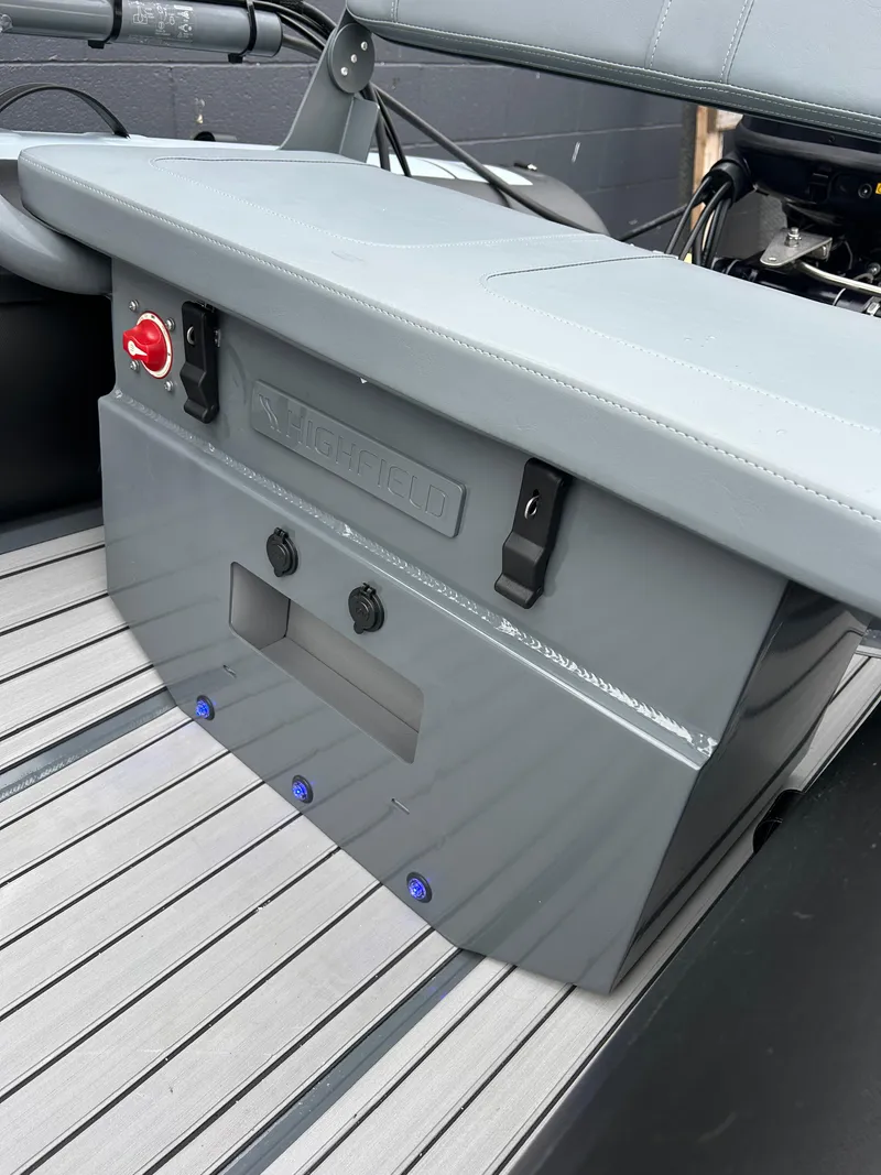 Slide: The Image of 2024 Highfield Classic 340 FCT boat interior with sleek gray seating and control panel. - 6