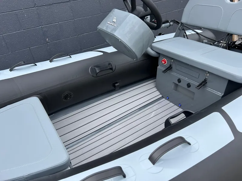 Slide: The Image of 2024 Highfield Classic 340 FCT boat interior with sleek seating and modern controls. - 7