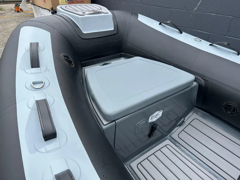 Slide: The Image of 2024 Highfield Classic 340 FCT inflatable boat interior with seating and storage. - 8