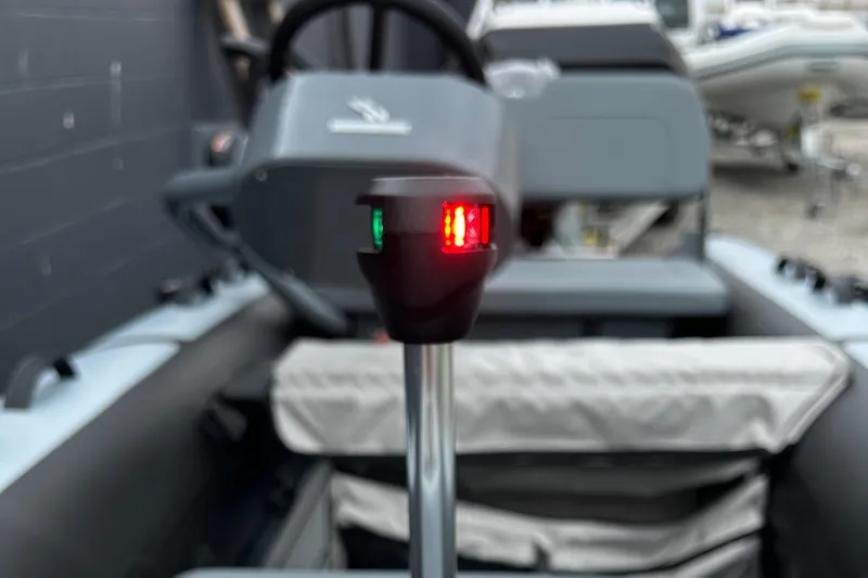 Slide: The Image of 2024 Highfield Classic 340 FCT boat with navigation lights and steering console. - 9