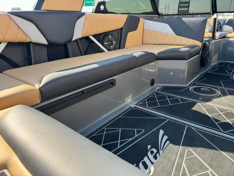 Slide: The Image of 2022 Tigé Z3 boat interior with stylish seating and modern design. - 12
