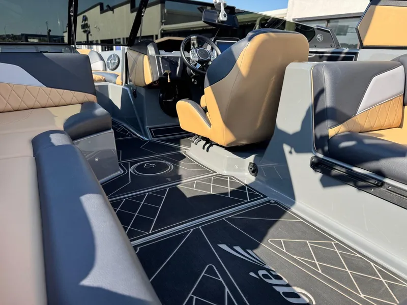 Slide: The Image of 2022 Tigé Z3 boat interior with stylish seating and modern dashboard design. - 13