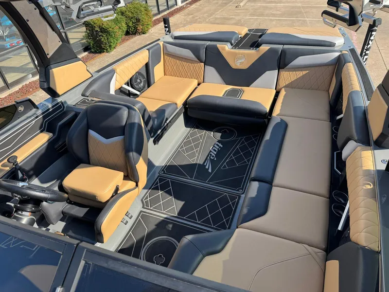 Slide: The Image of 2022 Tigé Z3 boat interior with luxurious tan and black seating. - 19