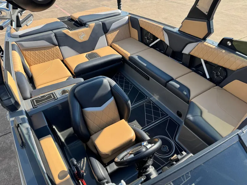 Slide: The Image of 2022 Tigé Z3 boat interior with luxurious tan and black seating. - 20