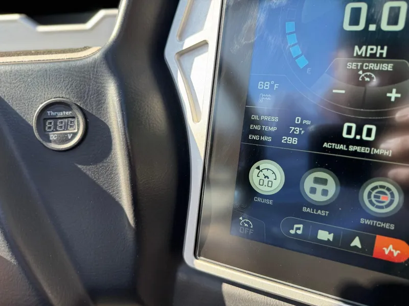 Slide: The Image of Dashboard of 2022 Tigé Z3 boat showing digital display and thruster control. - 23