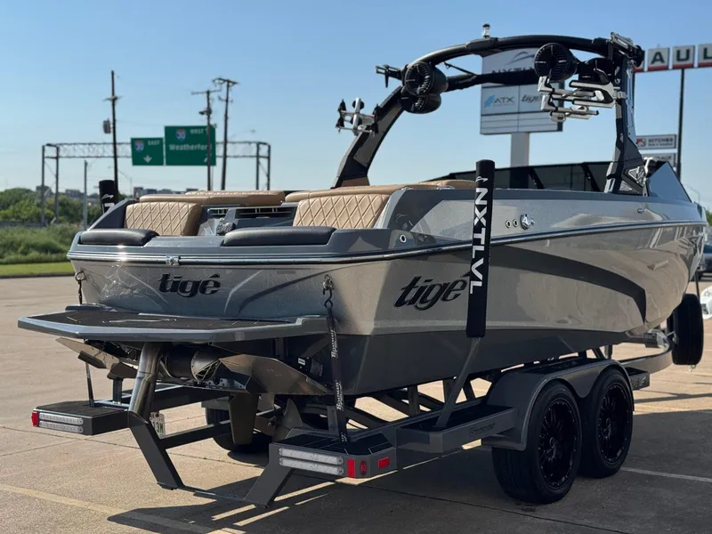 Slide: The Image of 2022 Tigé Z3 boat on trailer, featuring sleek design and modern amenities. - 6