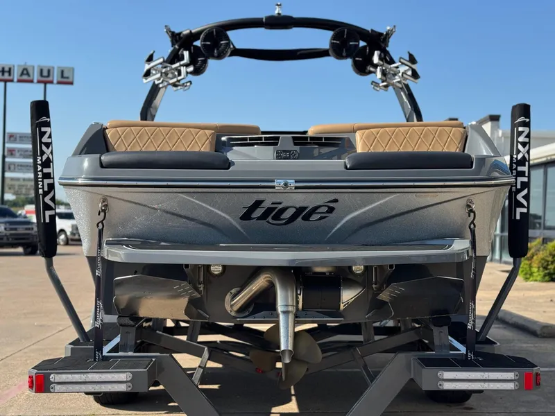 Slide: The Image of 2022 Tigé Z3 boat rear view on trailer, showcasing sleek design and branding. - 7