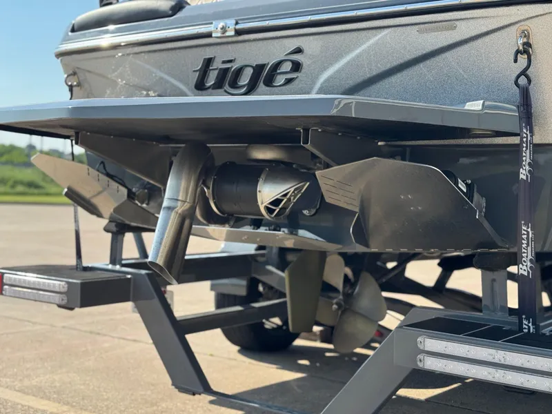 Slide: The Image of Rear view of a 2022 Tigé Z3 boat, showcasing its propeller and exhaust system. - 8