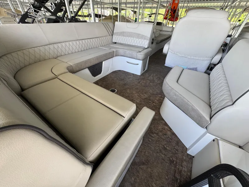Slide: The Image of Luxurious interior of 2019 Crest Savannah 250 SLS pontoon boat with plush seating. - 14