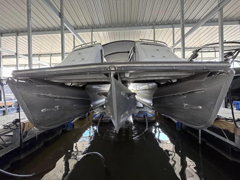 Slide: The Image of 2019 Crest Savannah 250 SLS pontoon boat docked in covered marina. - 22