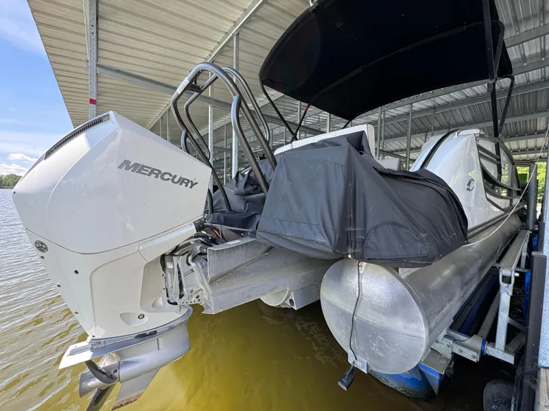 Slide: The Image of 2019 Crest Savannah 250 SLS pontoon boat with Mercury outboard engine in covered dock. - 23