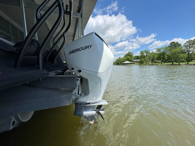 Slide: The Image of 2019 Crest Savannah 250 SLS with Mercury outboard motor on a sunny lake. - 27