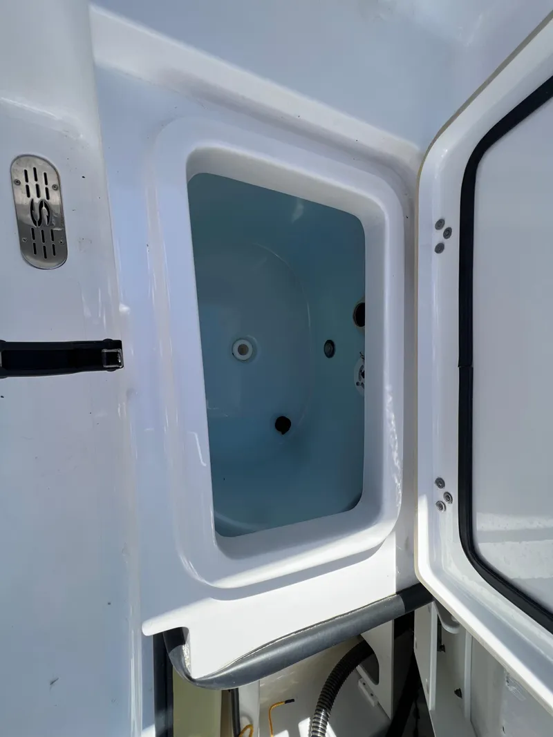 Slide: The Image of 2021 Sportsman Heritage 231 Center Console livewell interior view. - 20