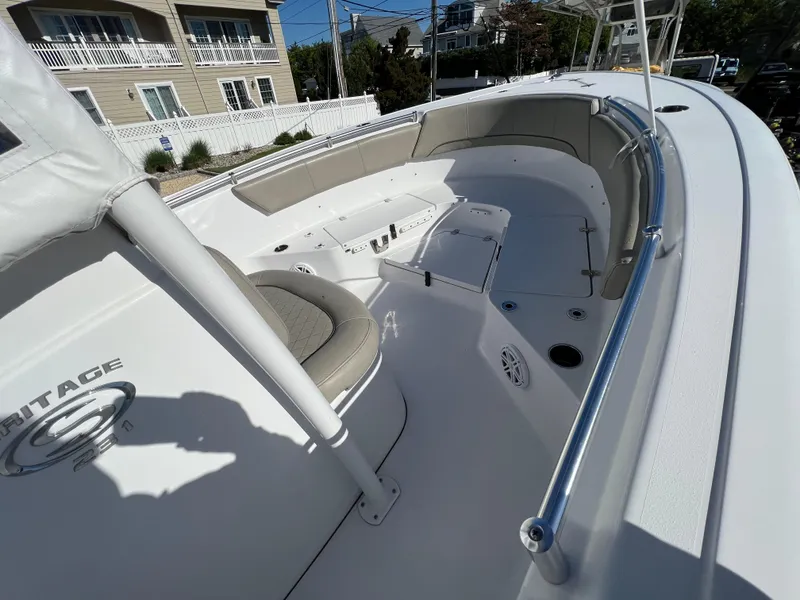 Slide: The Image of 2021 Sportsman Heritage 231 Center Console boat interior with seating and console view. - 22